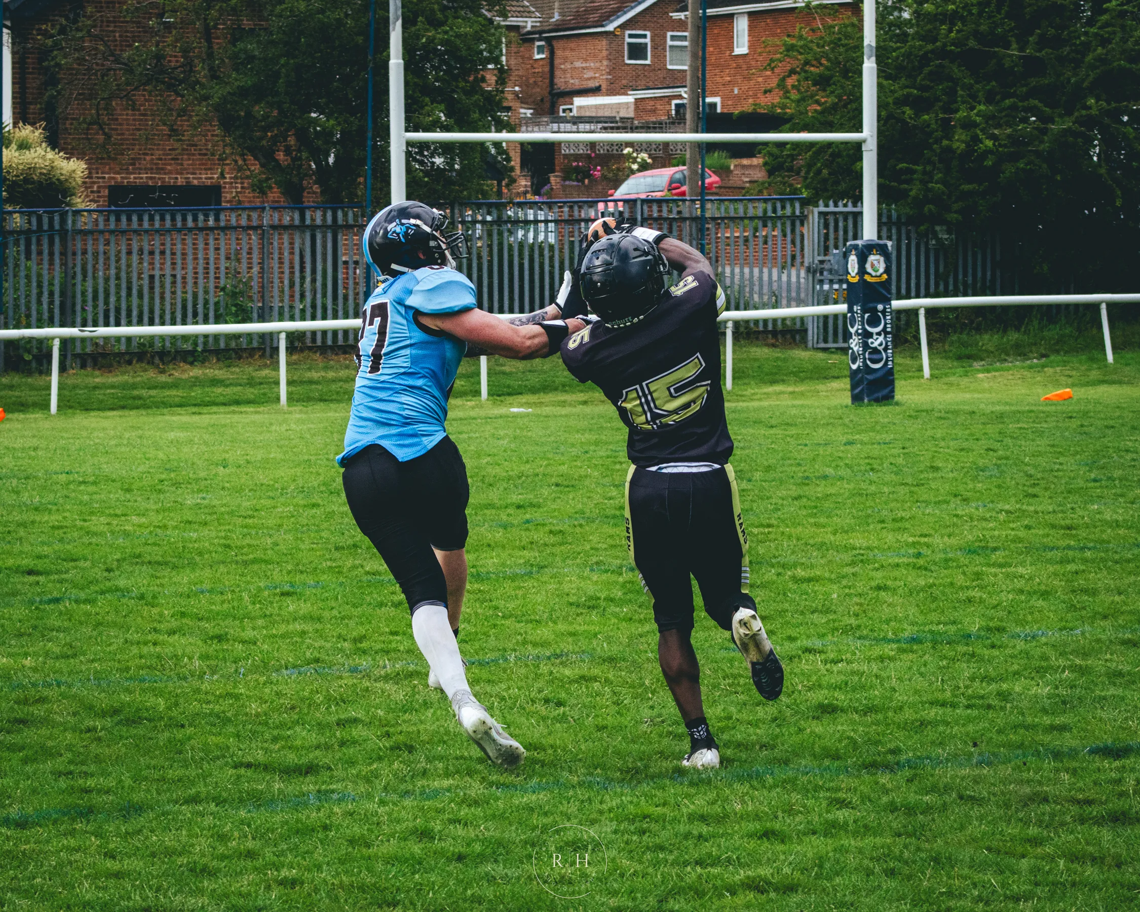Nathaniel Derrick battles a Giants receiver for the ball