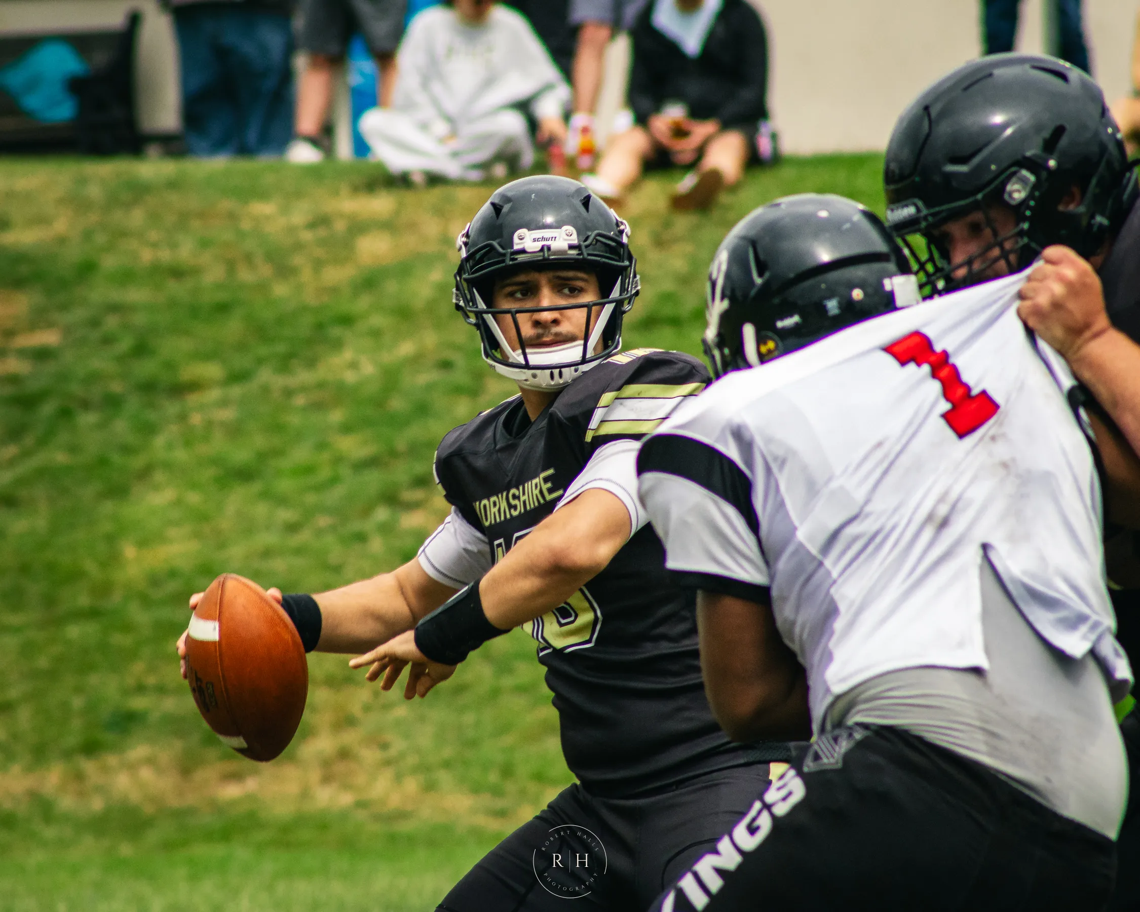 Michael Rojas looks to pass under pressure from the Vikings defence