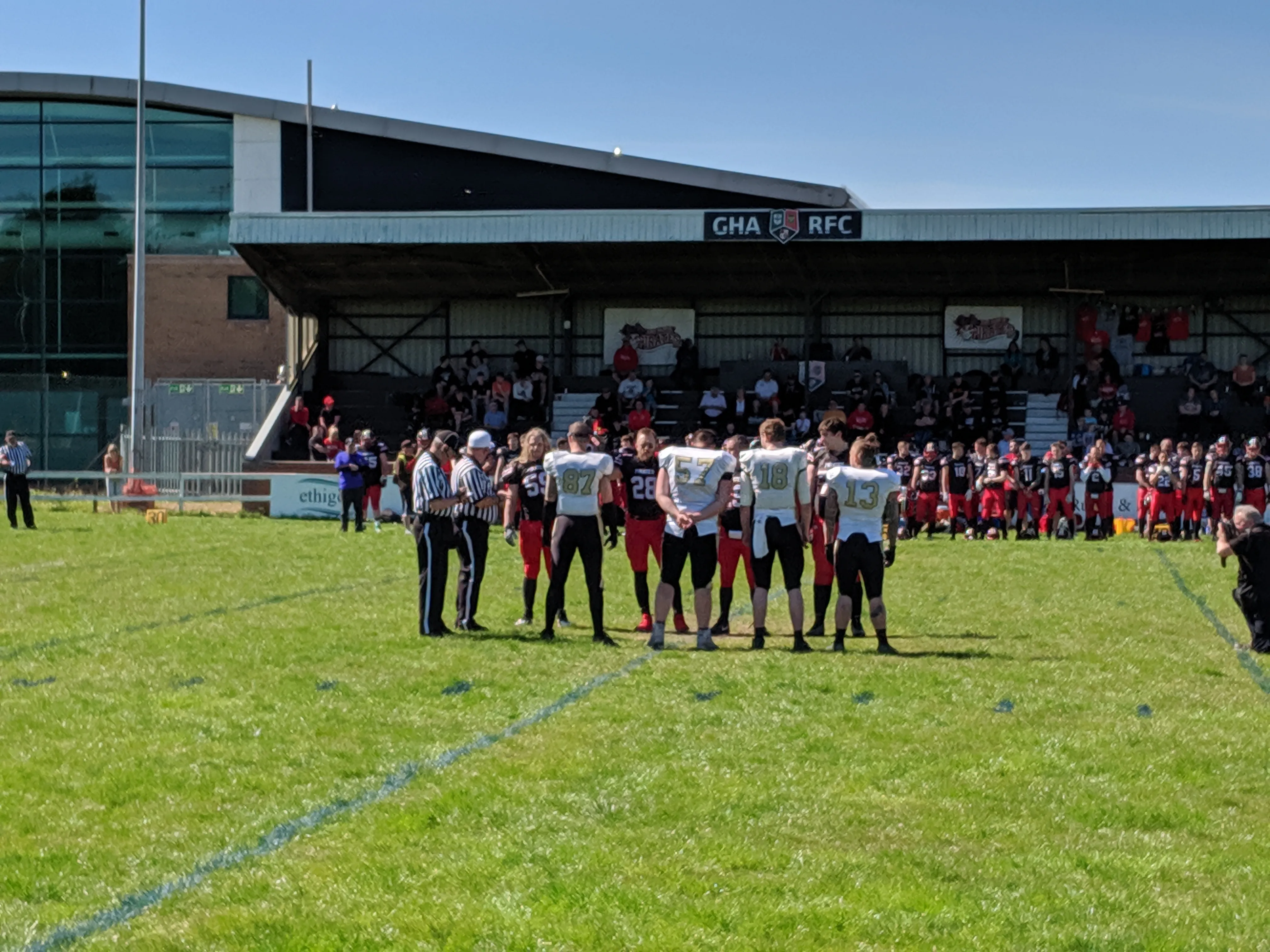 The captains meet in the centre of the field