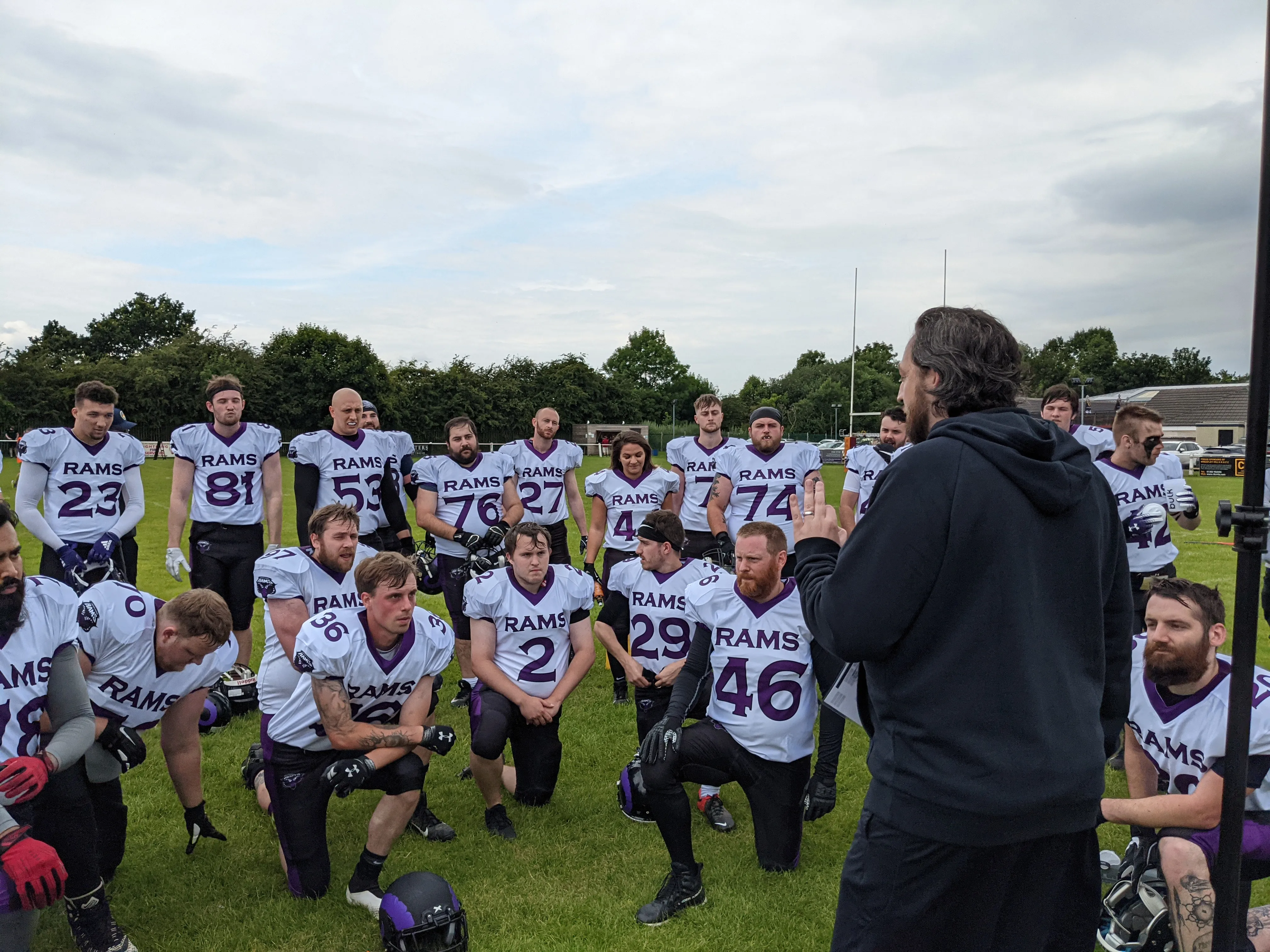 Coach Shaw speaks to the team at half time